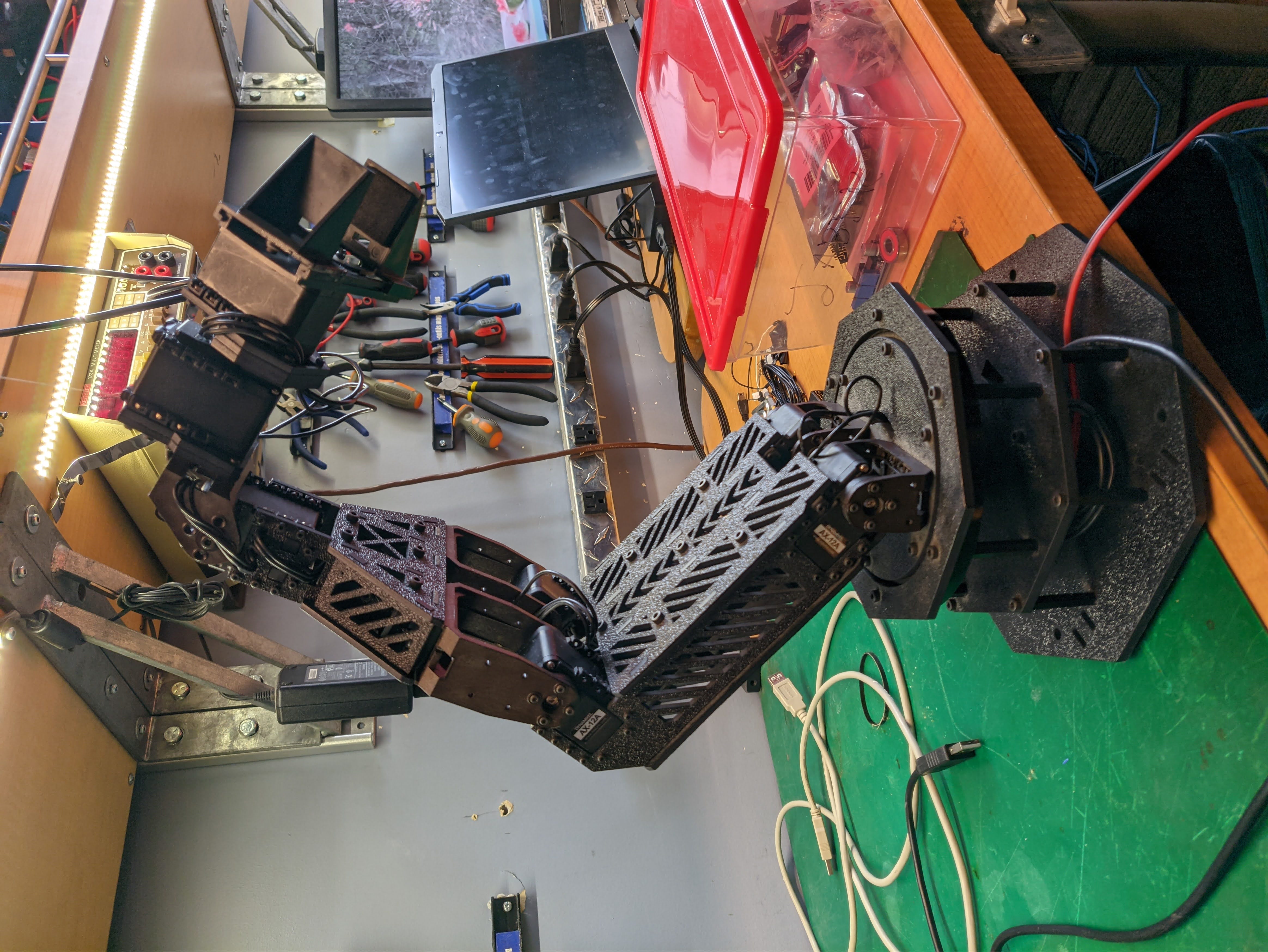 A small robotic arm with a gripper.